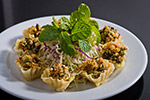 Eastern style spicy shrimp salad in Kratong tong